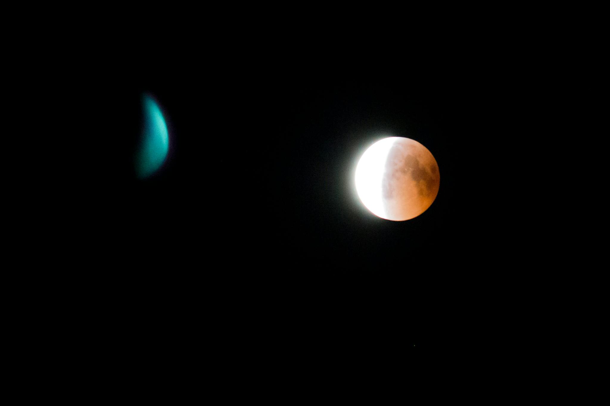 Captivating lunar eclipse with celestial body in a dark night sky.