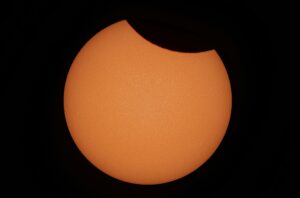 Capture of a partial solar eclipse with detailed solar surface in Dęblin, Poland.