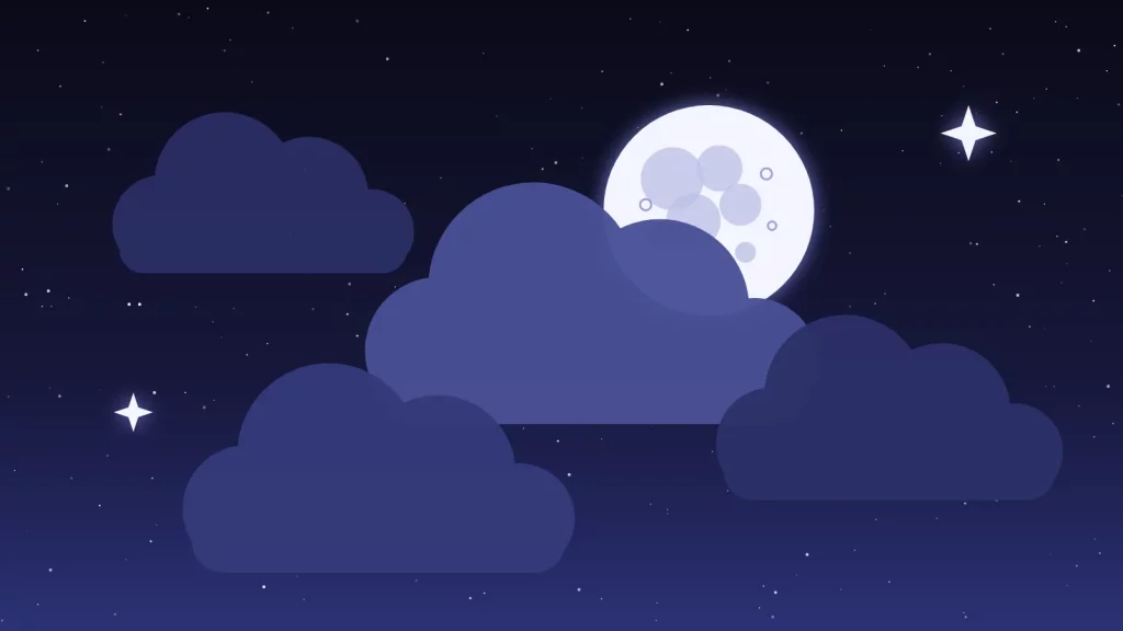 La Lune à demi cachée par des nuages dans un ciel étoilé